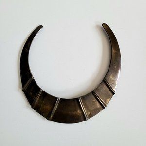 Brass choker.